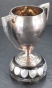 A good George V silver two-handled trophy of Art Deco design with tapering body, angular handles and