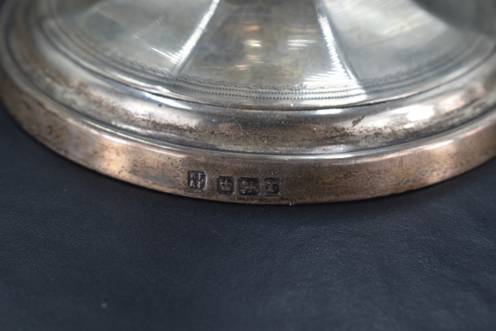 A pair of Edwardian silver candlesticks, of typical fluted form with fine engraved detail, marks for - Image 2 of 2