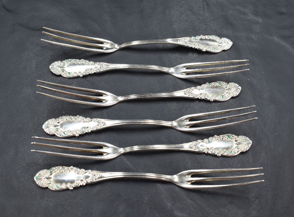 A set of six American sterling silver dessert or pastry forks, each having three slender tines,