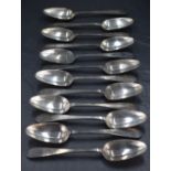 A set of twelve George V silver dessert spoons, Old English pattern pointed variant, engraved with