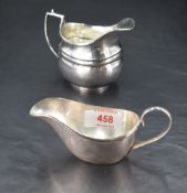 A George V silver cream jug, of moulded oval form with generous spout, angular handle and short oval
