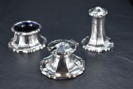An early 20th century silver three-piece condiment set, of spreading stylised petal design with