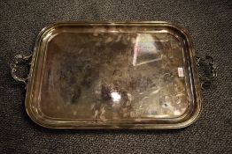 A large A1 electro-plated two-handled tray, of rounded rectangular form with scroll and shell form
