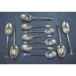A group of six 1930's silver and enamel coffee spoons, the terminals engine-turned and guilloche