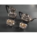 A George V silver four-piece silver teaset, comprising hotwater pot, teapot, sugar and cream, of