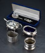 A group of mixed silver items items, comprising silver salt, mustard, two napkin rings and