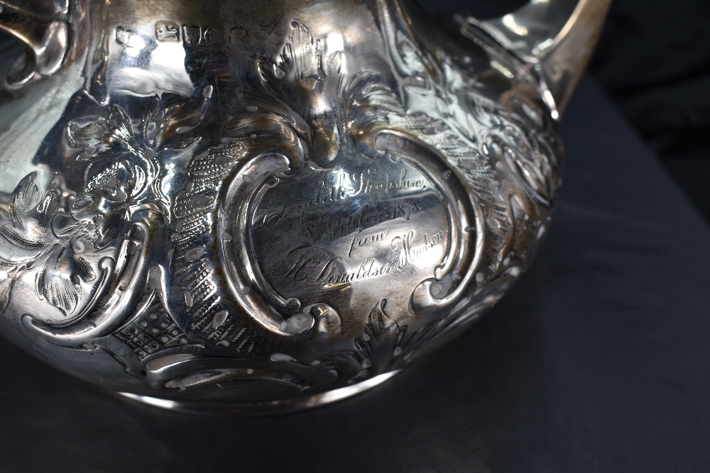 A Victorian silver teapot, having a domed foliate finial topped cover with embossed foliate - Image 3 of 3