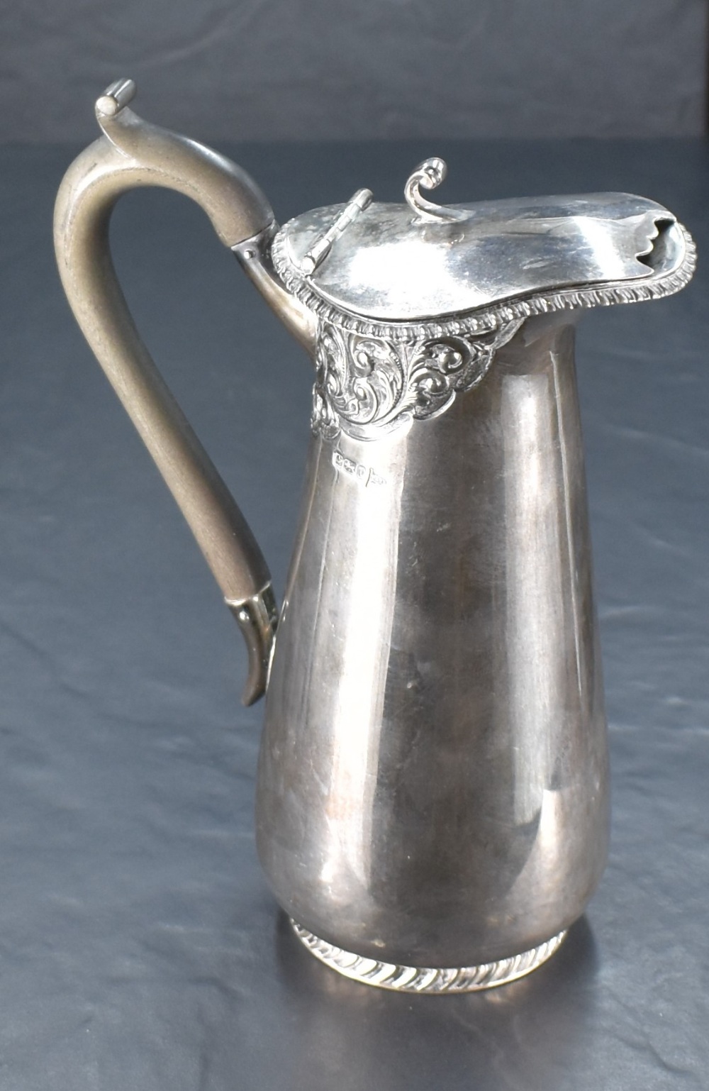 An Edwardian silver water jug, having a hinged cover with scrolled thumb piece over the gadrooned - Image 2 of 3