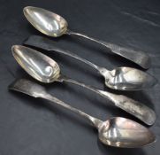 A group of three early 19th century Irish silver table spoons, fiddle pattern with engraved initials