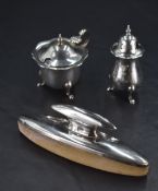 A George V silver two-piece condiment set, comprising pepperette and mustard, marks for London 1928,