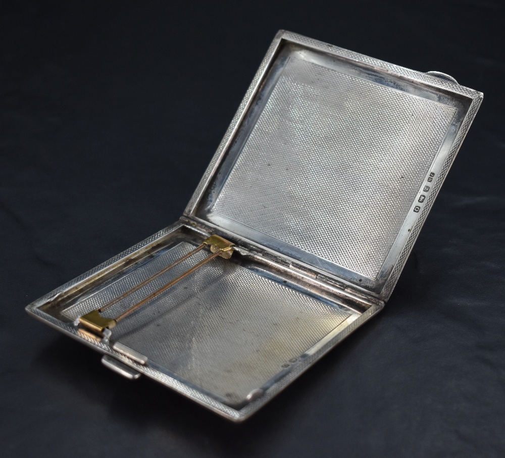 A 1930's silver cigarette case, of hinged rectangular form, engine-turned throughout, marks for - Image 2 of 2