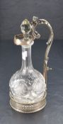 A late Victorian electro-plated bottle/decanter stand, having a scrolled acanthus and lion mask