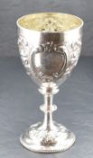 A large Victorian silver agricultural trophy, of traditional goblet form with embossed foliate and
