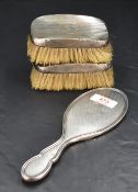 A George VI silver brush mount, with reed moulded and engine-turned decoration, marks for Birmingham