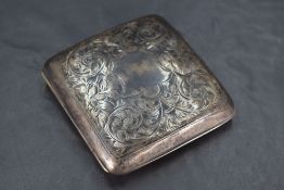 A George V silver cigarette case, of hinged rectangular form and curved for the gentleman's