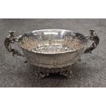 An impressive Victorian silver two-handled bowl, of circular form with finely embossed bellflower,