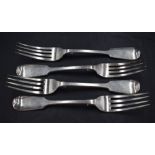 A group of four Victorian silver fiddle pattern forks, engraved stags head crest to reverse, marks