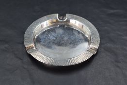 A George VI silver ashtray, of circular form with moulded rests and engine-turned decoration,