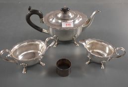 A George V silver three piece teaset, comprising a teapot, sugar and cream, each of oval form with