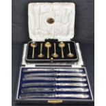 A cased set of six George V silver gilt coffee spoons, with engraved stylised decoration to