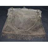 A George V silver mesh purse, the clasp with acorn finials over the shaped mounts engraved with