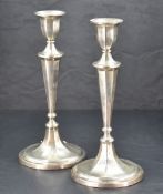 A pair of Edwardian silver candlesticks, of typical fluted form with fine engraved detail, marks for