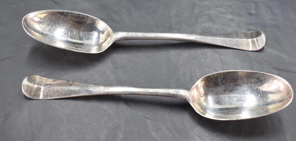 A pair of early 19th century Irish silver table spoons, Hanoverian pattern with engraved lion head