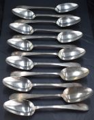 A set of twelve George V silver table spoons, Old English pattern pointed variant, engraved with