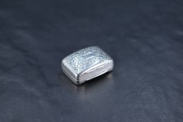 A George IV silver vinaigrette, of hinged rectangular form and curved for the pocket, engraved