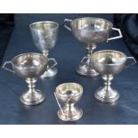 A group of five Golfing related silver trophies, various designs, ages and makers, gross weight