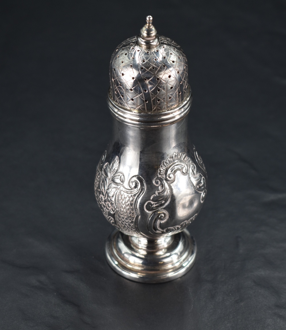 A Victorian silver sugar caster, having a pierced, finial topped and engraved cover over the foliate