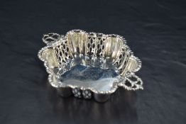 A late 19th/early 20th century silver two-handled dish, of lobed hexagonal form with stylised and