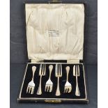 A cased set of six George V silver dessert forks, Hanoverian pattern with marks for Birmingham 1930,