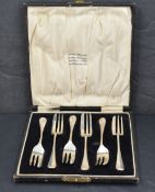 A cased set of six George V silver dessert forks, Hanoverian pattern with marks for Birmingham 1930,