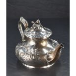 A Victorian silver teapot, having a domed foliate finial topped cover with embossed foliate