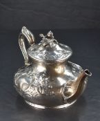 A Victorian silver teapot, having a domed foliate finial topped cover with embossed foliate