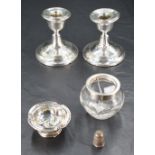 A pair of George V silver squat candlesticks, each moulded with reeded bands, marks for Birmingham