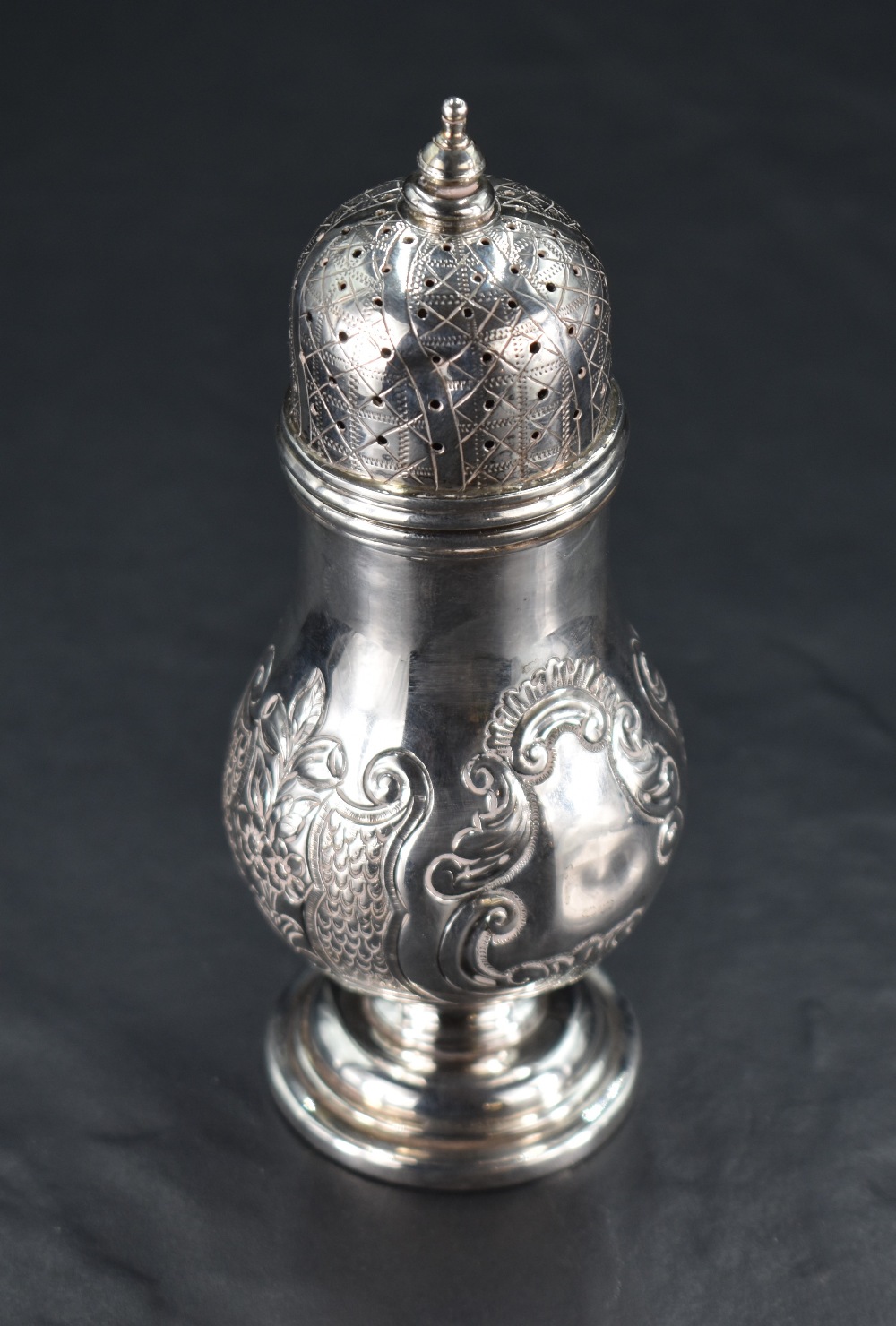 A Victorian silver sugar caster, having a pierced, finial topped and engraved cover over the foliate - Image 2 of 3