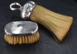 A Victorian silver mounted crumb brush with loop handle and planished surface, marks for