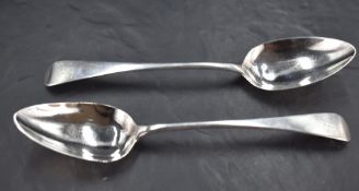 A pair of George III silver serving spoons, Old English pattern with engraved initials IL, marks for