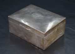 A George V silver cigarette box, of hinged plain rectangular form, the cover engraved with