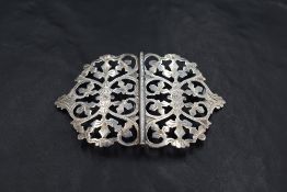 An Edwardian silver nurses belt buckle, of traditional design with engraved detail, marks for