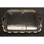 A George V silver two-handled tray, of rounded and dished rectangular form with Chippendale
