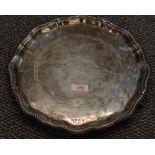 An early Queen Elizabeth II silver salver, having petal shaped and gadrooned Chippendale style rim