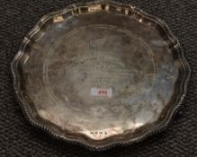 An early Queen Elizabeth II silver salver, having petal shaped and gadrooned Chippendale style rim