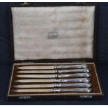 A cased set of six silver bladed and handled dessert knives, amrks for Sheffield 1946, maker