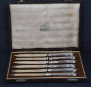 A cased set of six silver bladed and handled dessert knives, amrks for Sheffield 1946, maker