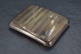 A George VI silver cigarette case, of hinged rectangular form and curved for the gentleman's pocket,
