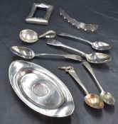 A group of mixed silver items, to include spoons, oval stand, part photograph frame, silver mount,