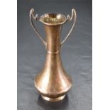 An Edwardian silver two-handled vase, of flared cylindrical form with slender shaped handles,